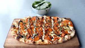 Roast Pumpkin Pizza with Rocket Salad side at Sugo Mi Source News Limited _April 2014